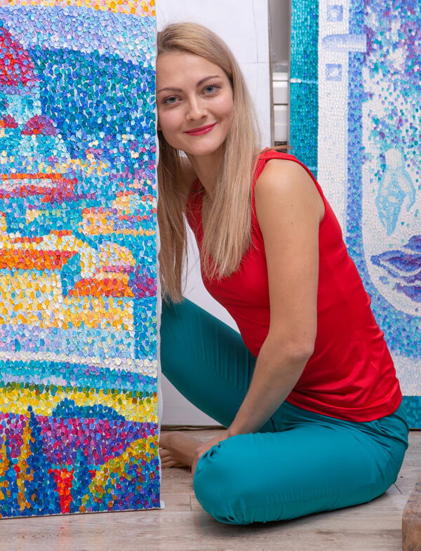 Artist Kristina Koròl among her paitings