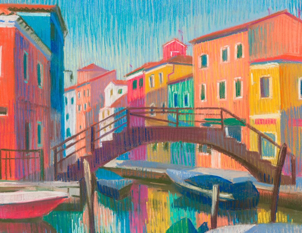 bridge on Venice canal and colorful houses