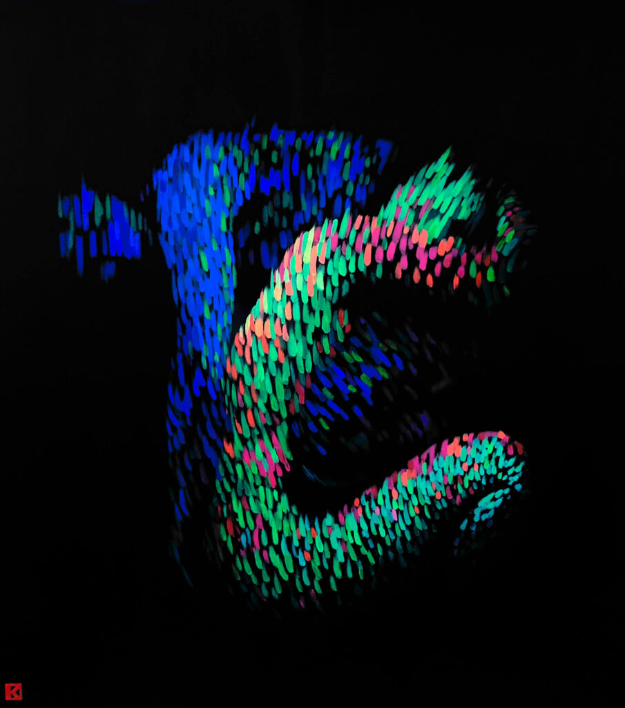 An abstract, biomorphic body emerges from a black background, composed of dense, luminous strokes in blue, green, and pink. The fragmented, digital texture suggests motion and touch while remaining partially dissolved, evoking themes of virtual presence, connection, and disembodied interaction of a woman and a man.