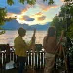 training on the como lake "en plein air" during sunsed with 2 students painting